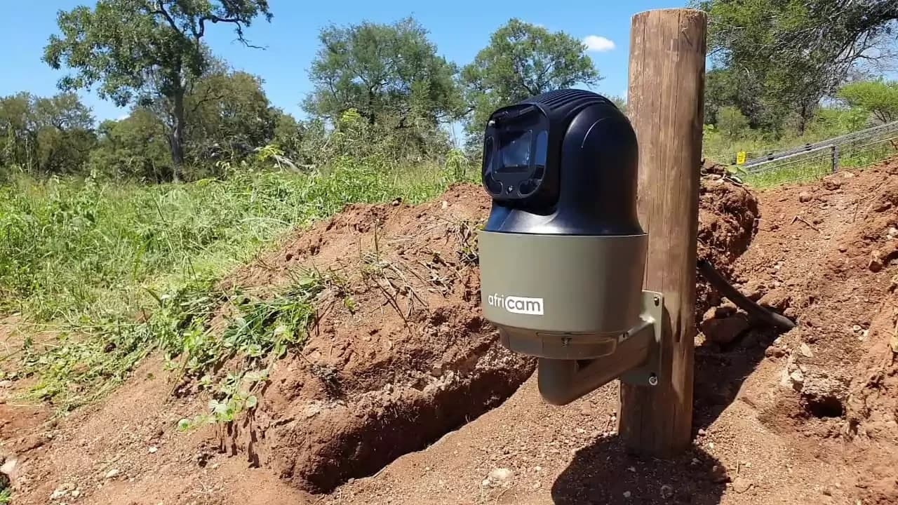 An Africam camera mounted on a post at a reserve, freshly installed