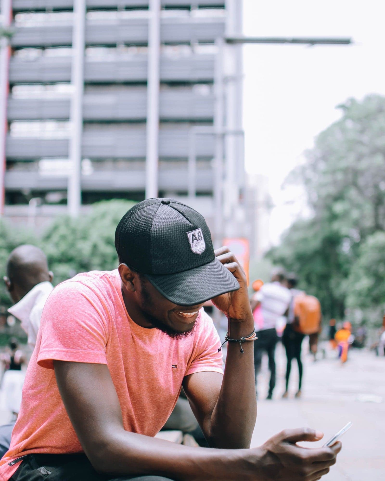 Checking a phone on a city street