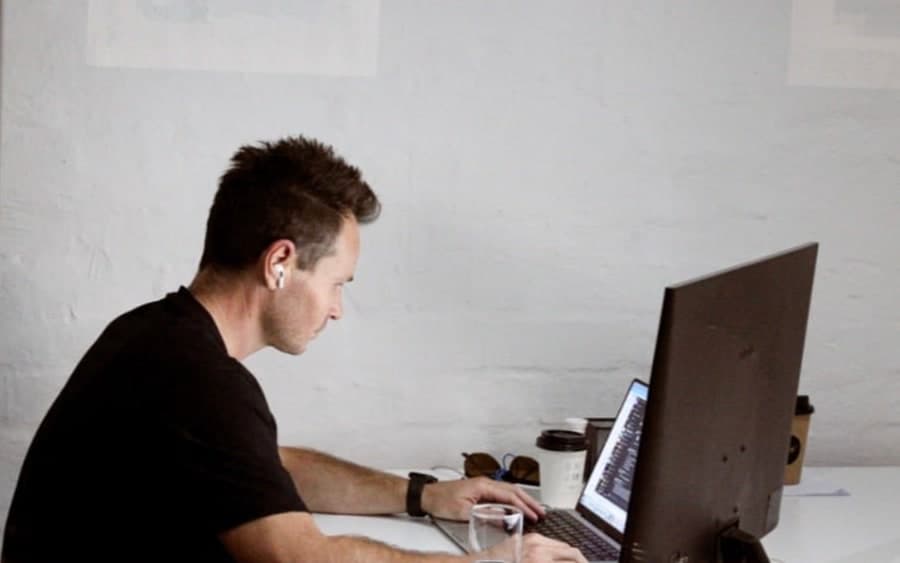 An engineer at a desk, working through a build