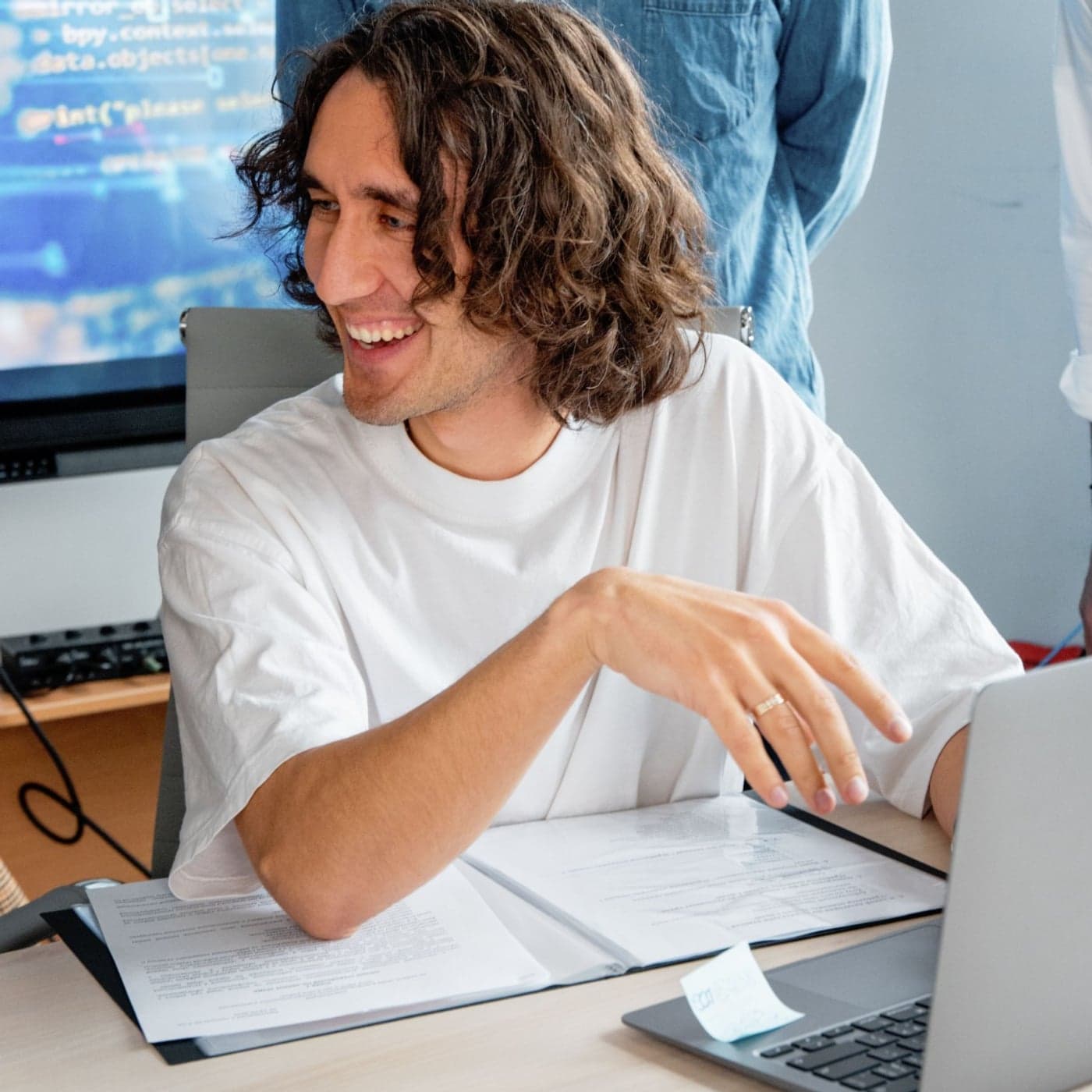 An engineer talking through a build at a laptop